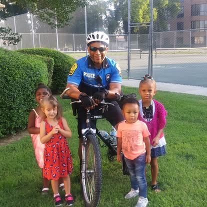 HUPD bike officers with children