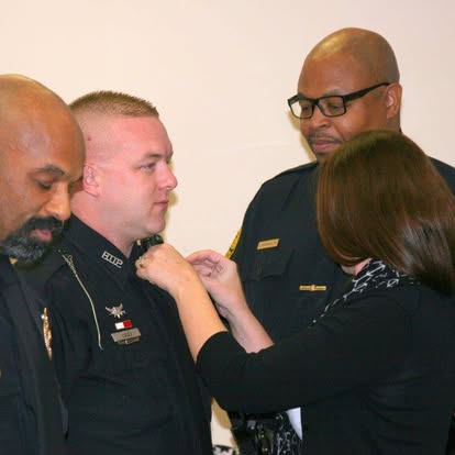 HUPD officer being pinned at a ceremony