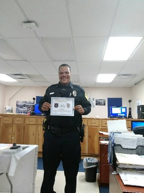 HUPD officer holding a certification